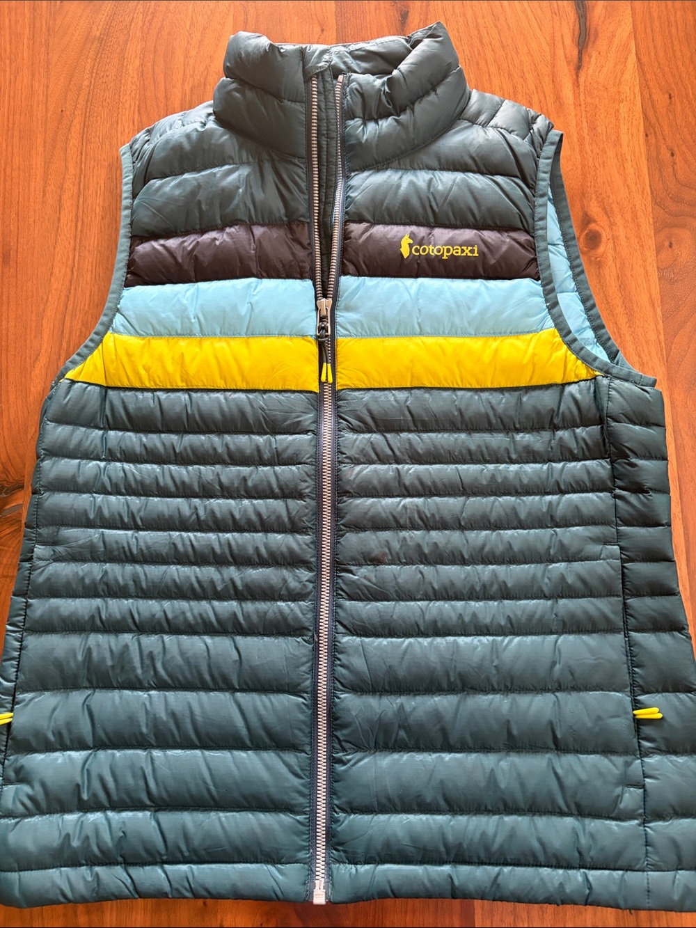 Cotopaxi Teal Puffer Vest with Yellow & Light Blue Stripes